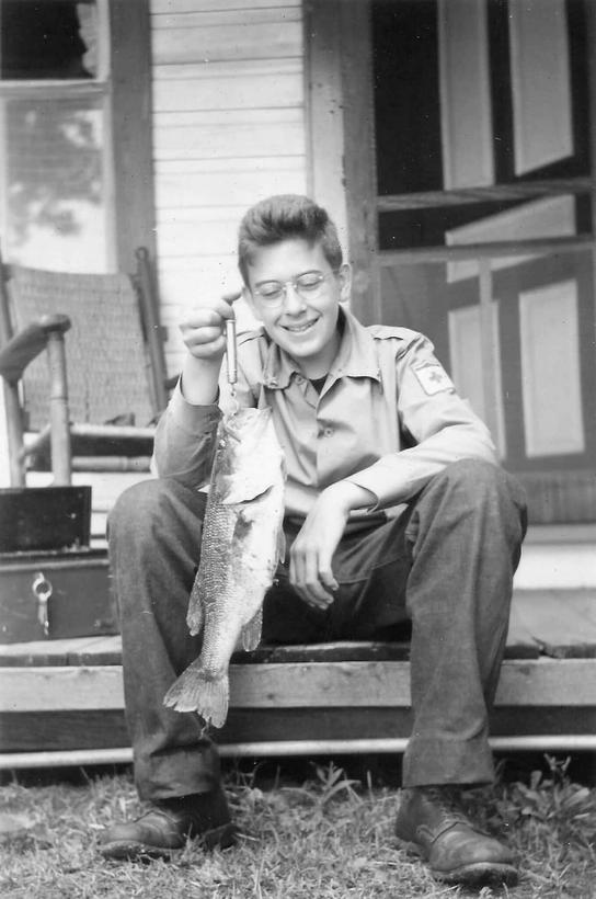young
            paul lyddon with a large mouthed bass he cuaght from sparrow lake