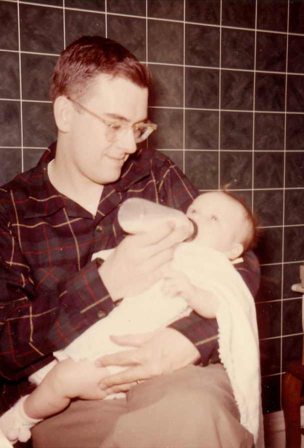 paul lyddon with his newborn daughter