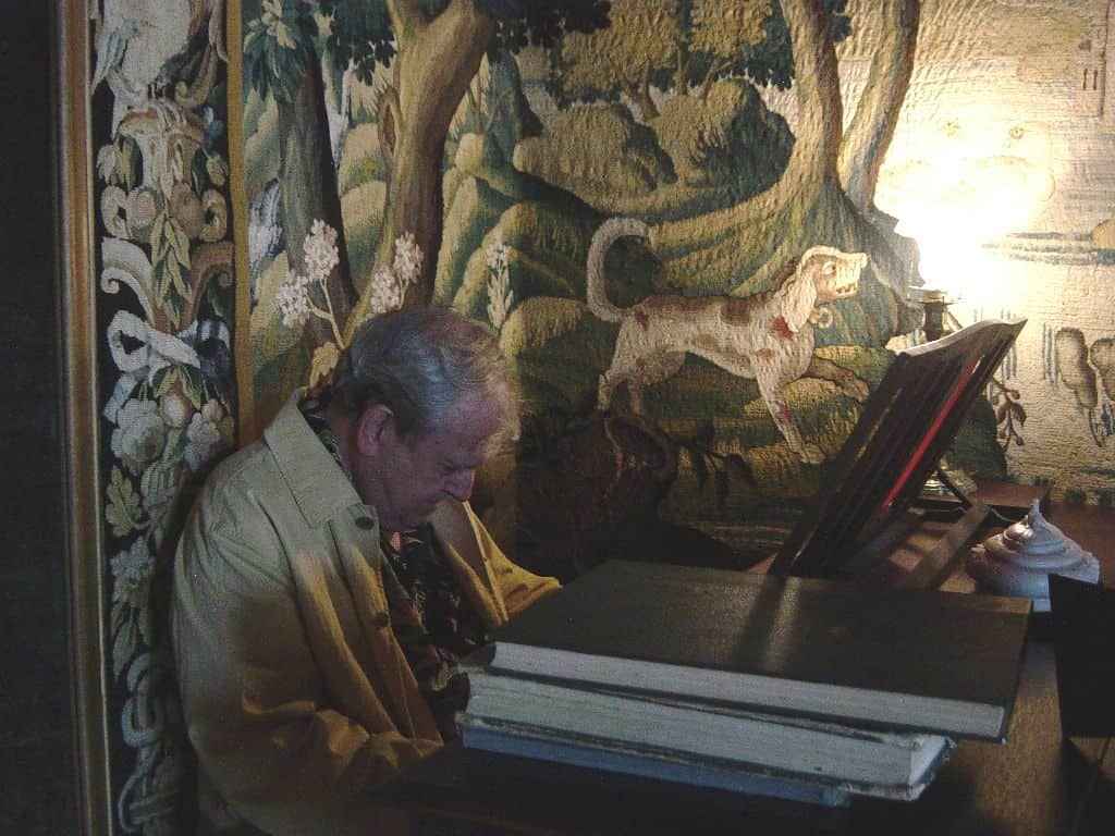 paul lyddon in the piano room in Château du Bosc