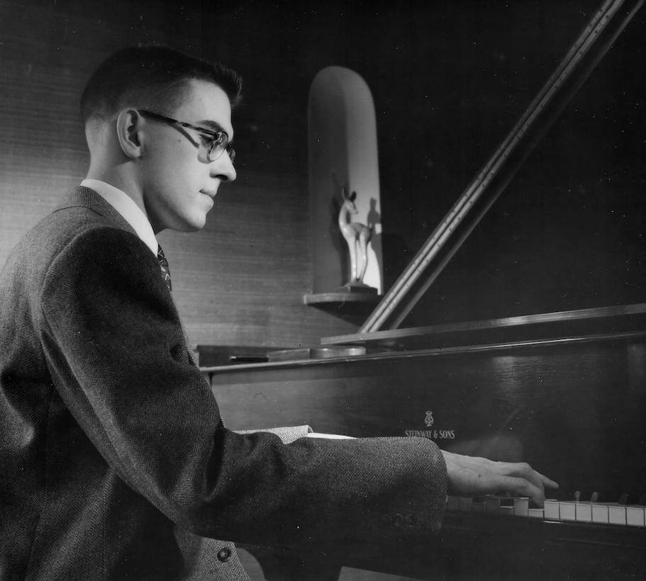 twenty year old paul
            playing the piano